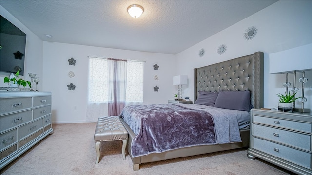 bedroom with carpet flooring, vaulted ceiling, and a textured ceiling