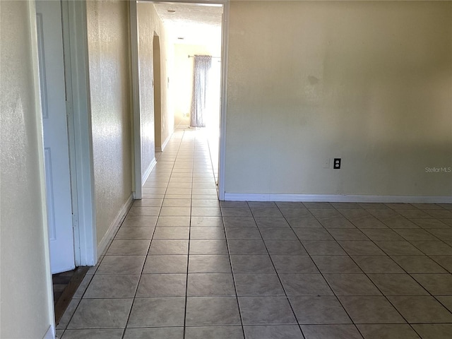 hallway featuring tile floors