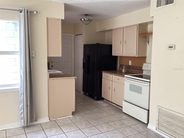 kitchen featuring light tile floors, black refrigerator with ice dispenser, and white range with electric stovetop