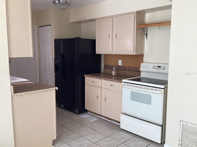 kitchen with white range with electric cooktop, black fridge with ice dispenser, and light tile floors