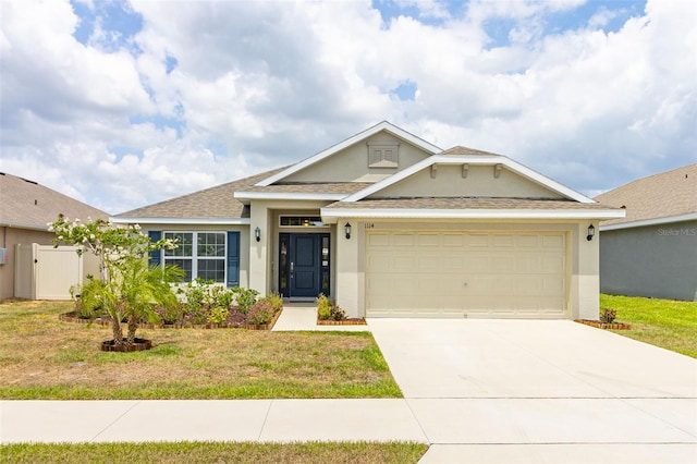 view of front facade with a front lawn and a garage