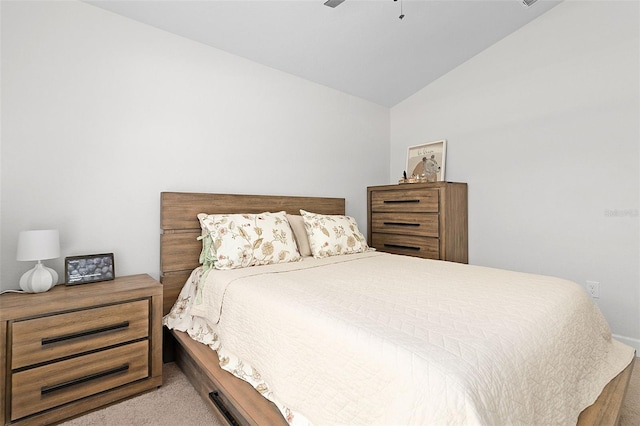 carpeted bedroom with vaulted ceiling and ceiling fan