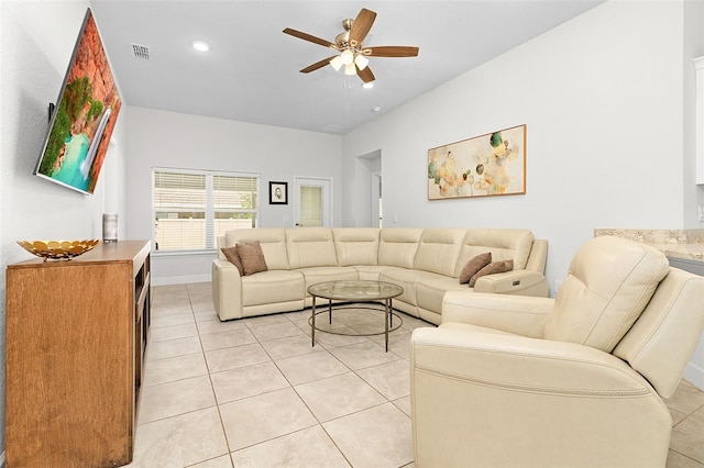 tiled living room with ceiling fan