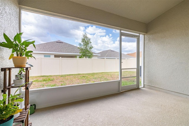 unfurnished sunroom featuring a wealth of natural light