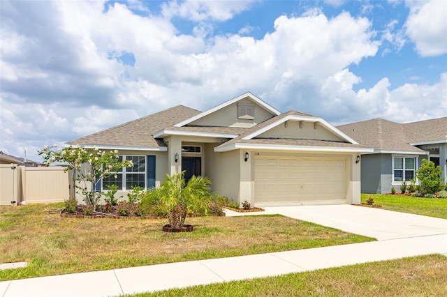 view of front facade with a garage and a front lawn