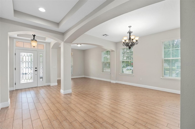 foyer entrance featuring light hardwood / wood-style floors and a wealth of natural light