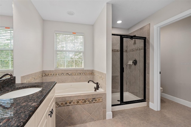 full bathroom with plenty of natural light, vanity, toilet, and plus walk in shower