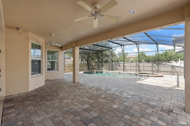 unfurnished sunroom featuring a swimming pool and ceiling fan