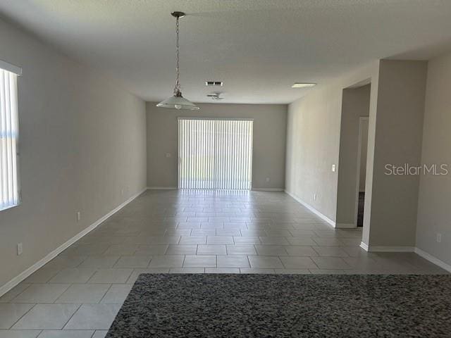 view of tiled spare room