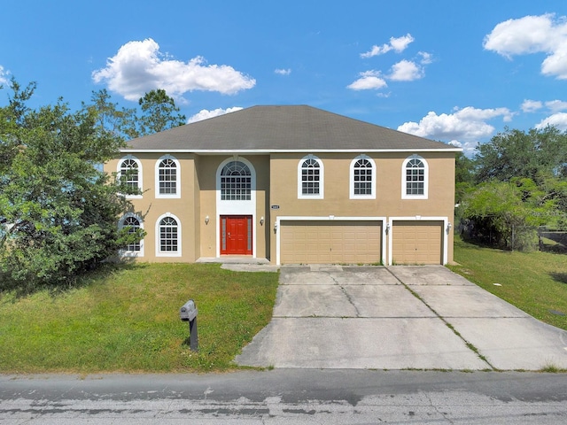 view of front facade featuring a garage and a front yard