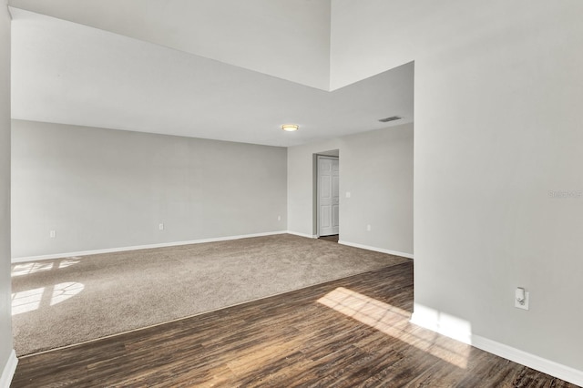 empty room featuring dark wood-type flooring