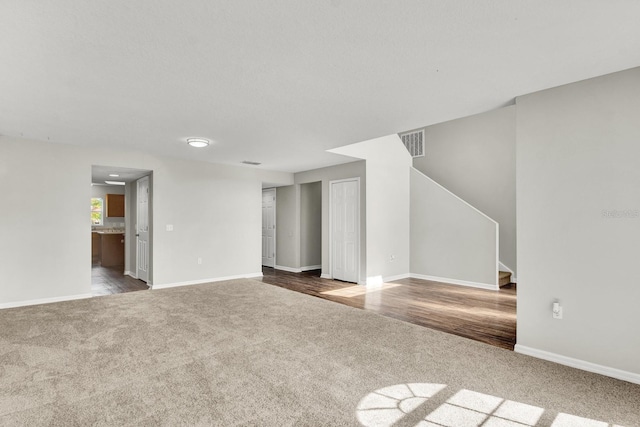 unfurnished living room with carpet