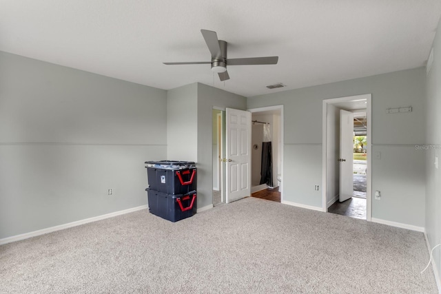 unfurnished bedroom featuring carpet flooring and ceiling fan