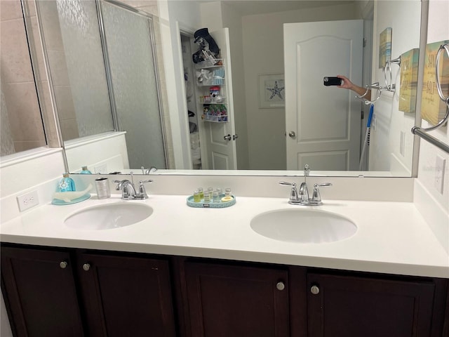 bathroom with vanity and an enclosed shower