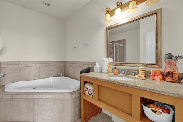 bathroom with tile patterned flooring, vanity, and separate shower and tub