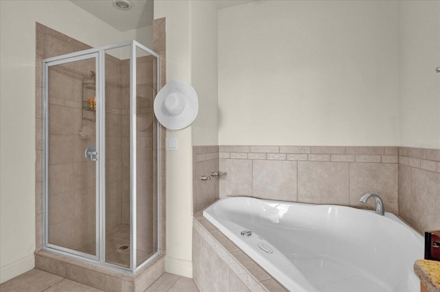 bathroom with tile patterned flooring and plus walk in shower