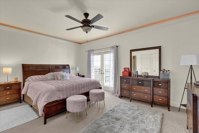 bedroom featuring ceiling fan, crown molding, light carpet, and french doors