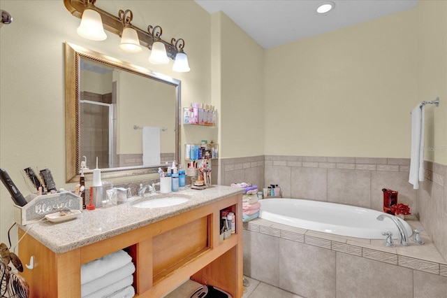 bathroom featuring tile patterned flooring, vanity, and independent shower and bath