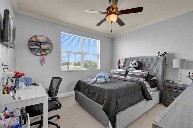 carpeted bedroom with ceiling fan and ornamental molding