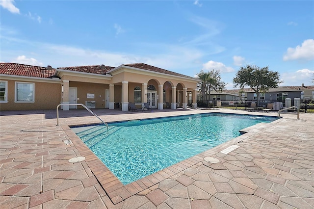 view of swimming pool featuring a patio