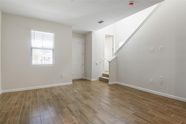 spare room with dark hardwood / wood-style flooring