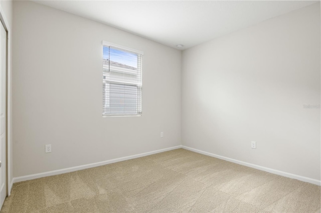 spare room featuring carpet flooring