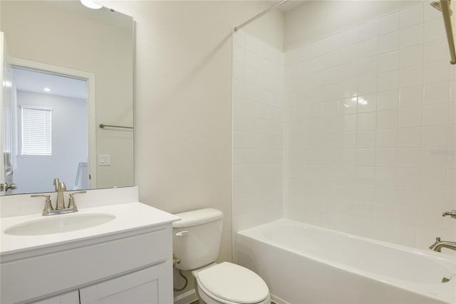 full bathroom featuring vanity, toilet, and tiled shower / bath