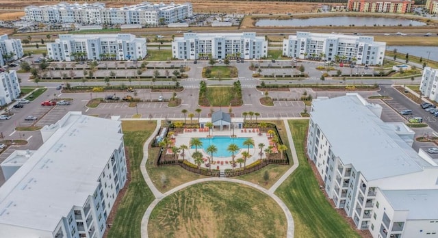 birds eye view of property with a water view