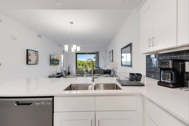 kitchen with sink, decorative light fixtures, dishwasher, white cabinets, and backsplash