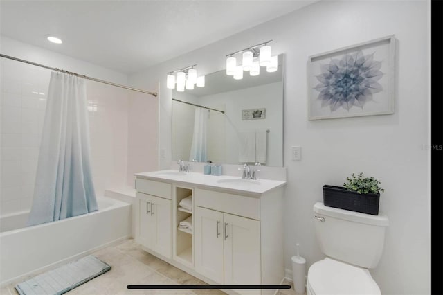 full bathroom with vanity, tile patterned floors, shower / bath combination with curtain, and toilet