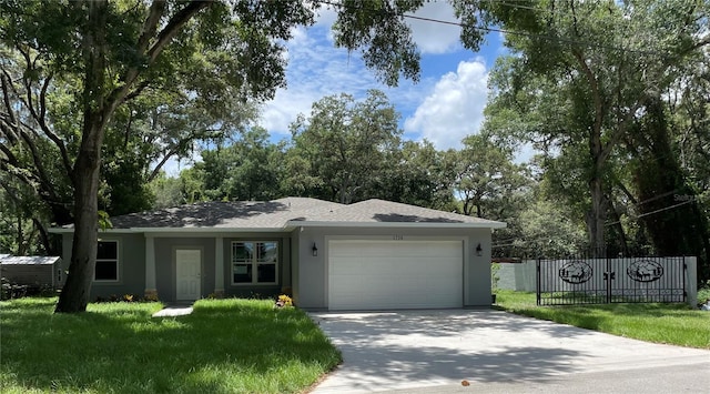 ranch-style home featuring a front lawn and a garage