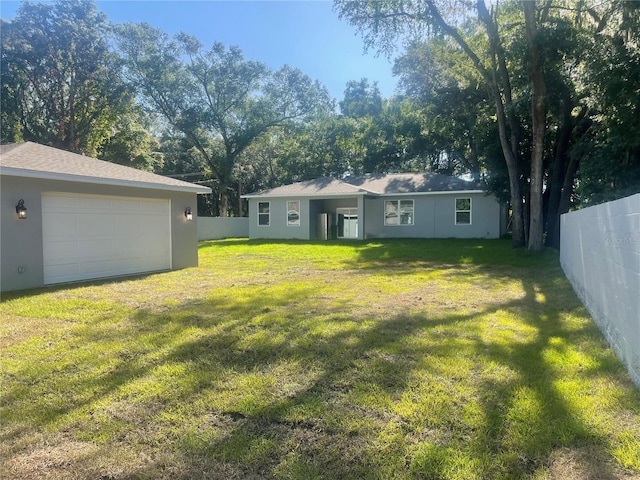 view of yard with a garage