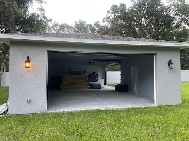 garage featuring a lawn