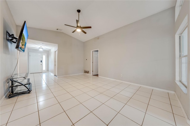 tiled spare room featuring ceiling fan and lofted ceiling