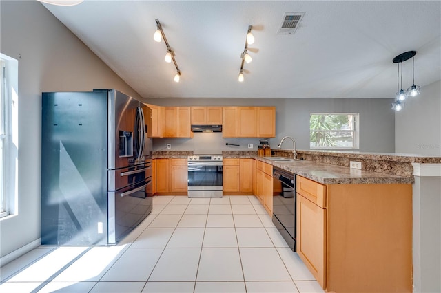 kitchen featuring light brown cabinets, hanging light fixtures, sink, light tile patterned floors, and appliances with stainless steel finishes