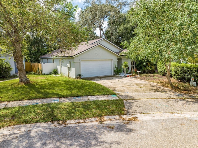 view of front of house with a garage and a front yard