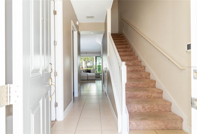 staircase with tile patterned floors