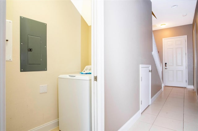 washroom featuring washer / clothes dryer, light tile patterned floors, and electric panel