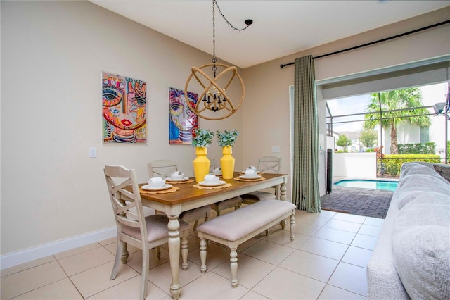 tiled dining area with a notable chandelier