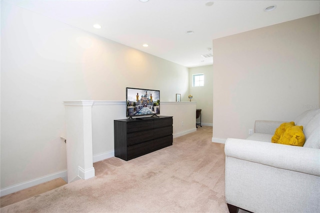 living area featuring light colored carpet