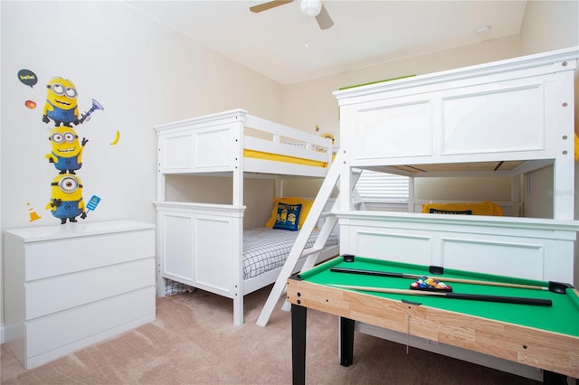 bedroom with ceiling fan and light carpet