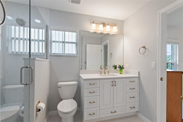 bathroom featuring a shower with door, vanity, a textured ceiling, and toilet