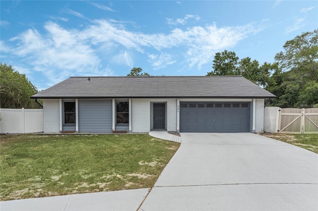 single story home with a front lawn and a garage