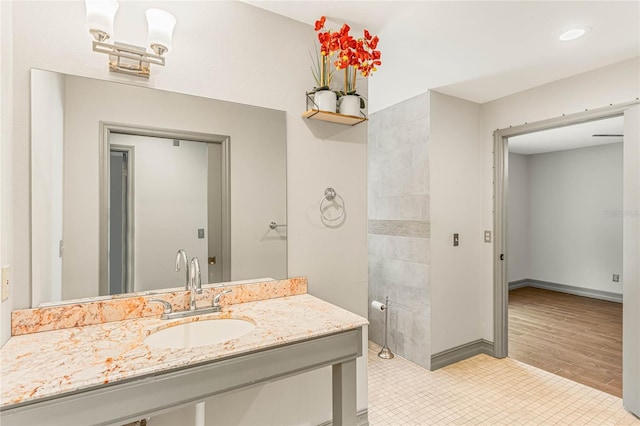 bathroom featuring hardwood / wood-style floors and vanity