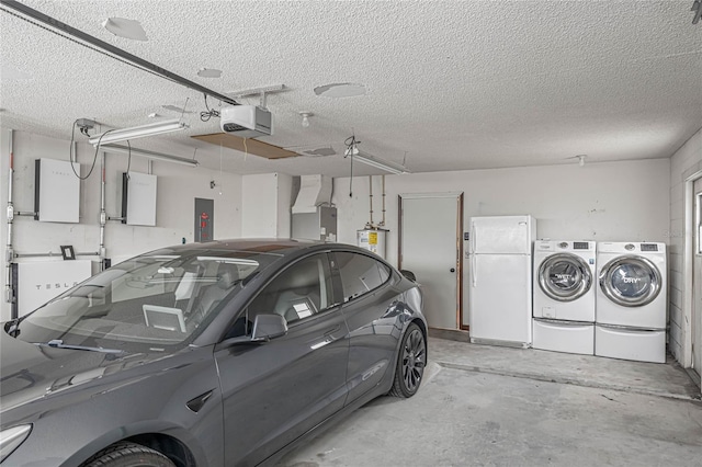 garage featuring electric panel, a garage door opener, white refrigerator, washing machine and dryer, and water heater