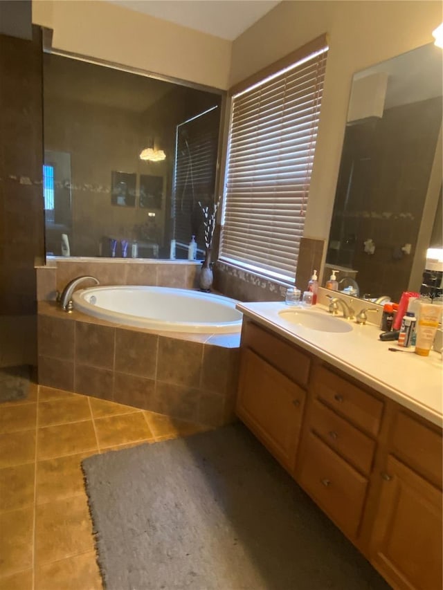 bathroom with tile patterned flooring, vanity, and separate shower and tub