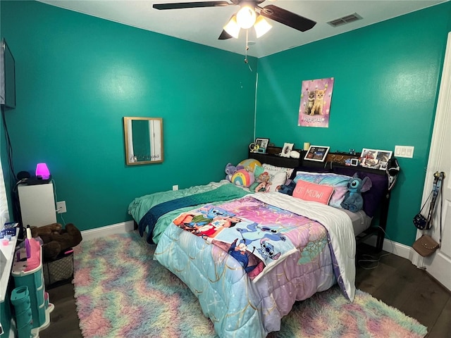 bedroom featuring ceiling fan and hardwood / wood-style flooring