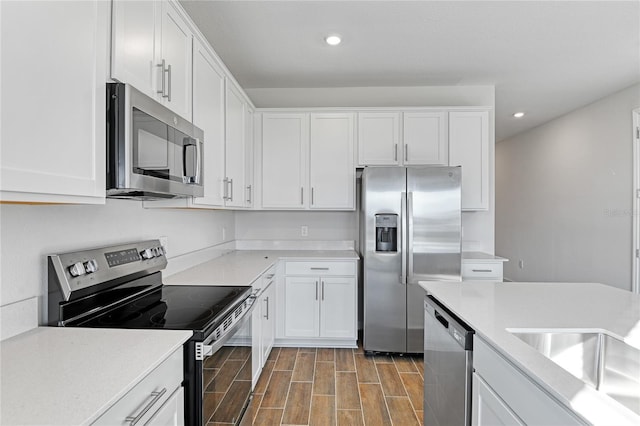 kitchen featuring white cabinetry and stainless steel appliances