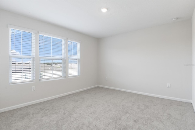 empty room with light colored carpet