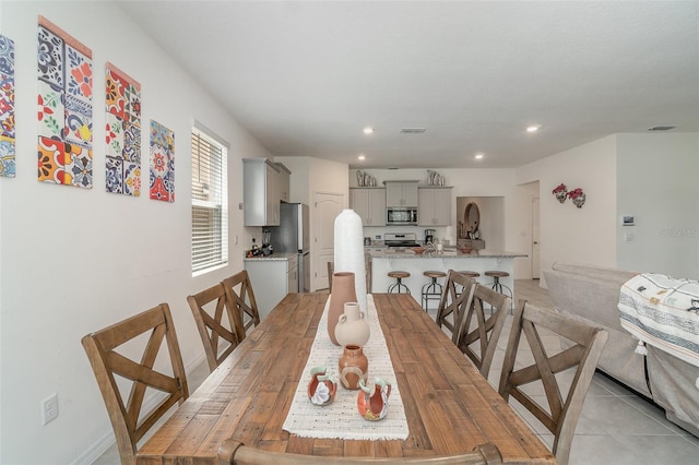 dining room featuring light tile patterned floors